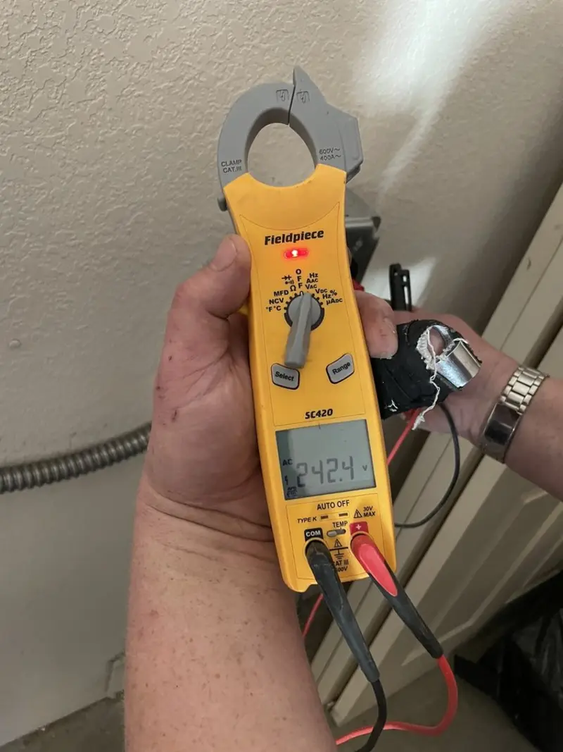 Voltage testing with clamp meter during Ceiling Fan Installation in Rockport